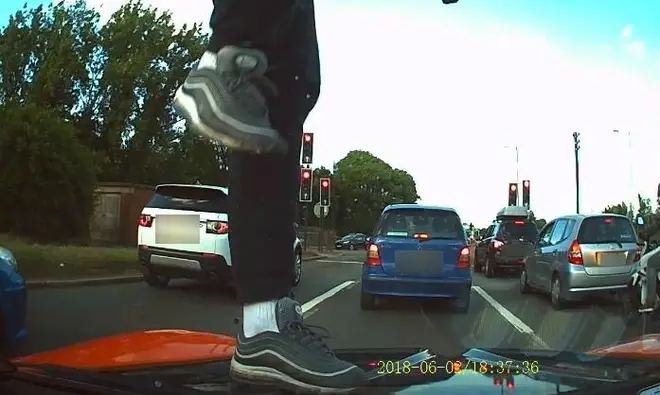 Moped thieves jump on car bonnet