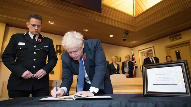 Mr Johnson signed the condelence book alongside Home Secretary Priti Patel