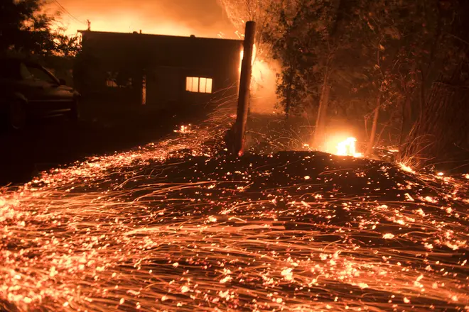 Thousands of little spot fires burn from wind driven embers in Healdsburg, California