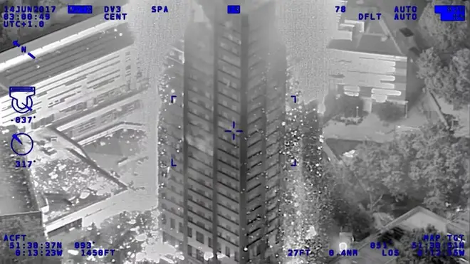 An infra-red photo from a police helicopter showing  burning debris falling from the tower block, police officers used riot shields to protect firefighters on the night of the fire
