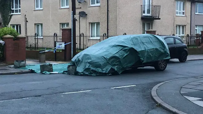 A car was seen covered at the scene the morning after the incident