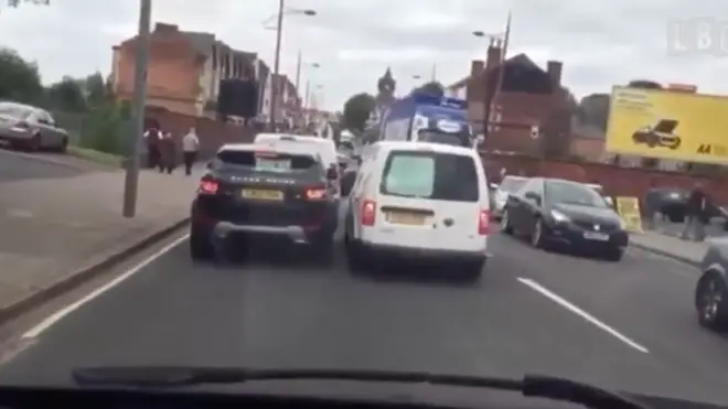 A squabble between two motorists escalated as one gets punched in the face.