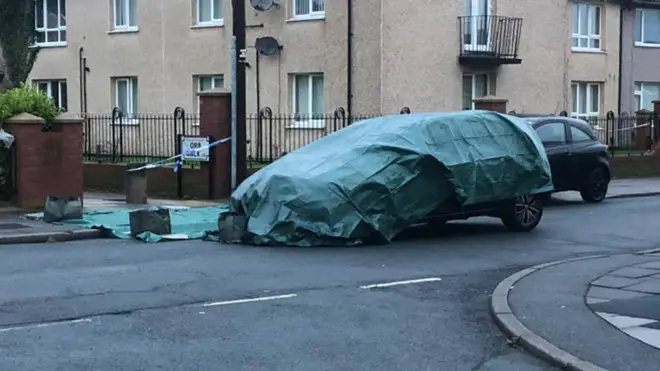 A car was seen covered at the scene the morning after the incident.