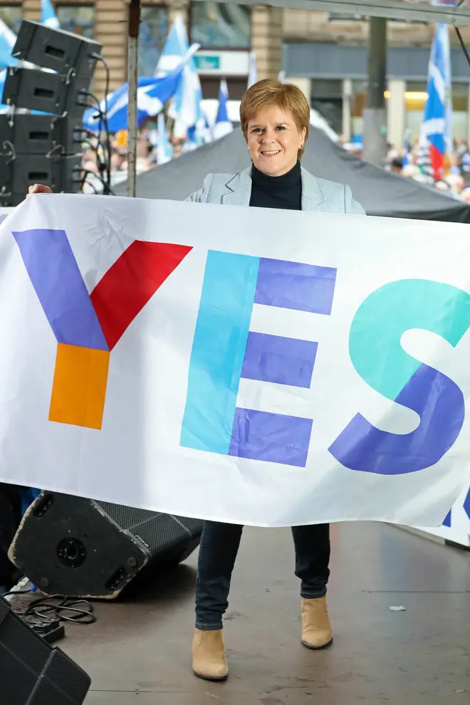 Nicola Sturgeon with a Yes to independence sign