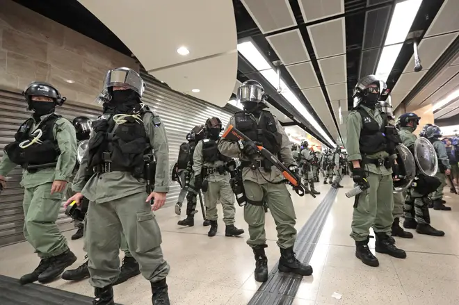 Riot police form a line at a shopping centre in Hong Kong