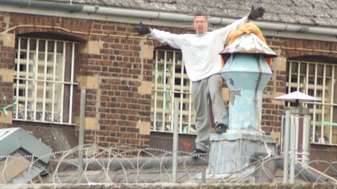 The prisoner climbed onto the roof at 11am on Monday
