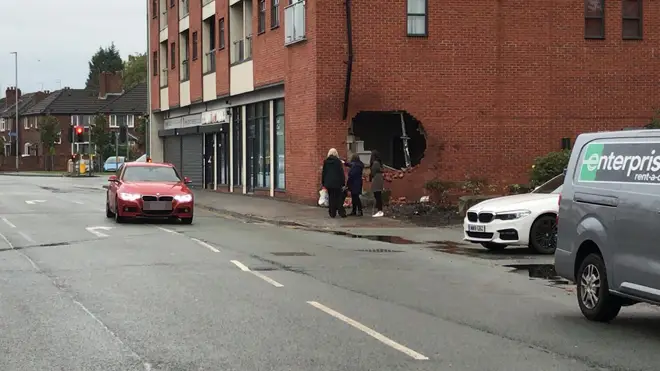 The hole in the wall at the scene of the fatal crash in Burnage
