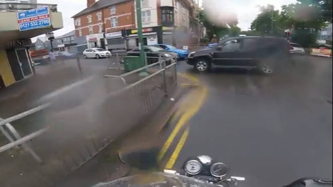 The shocking incident was caught on a nearby motorbiker's headcam.