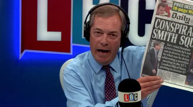 Nigel Farage holds a copy of today's Daily Mail