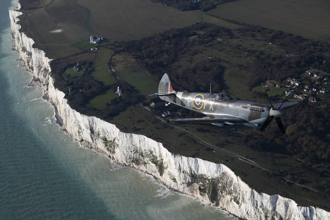 One of the Spitfires following a World War II Dakota before it dropped three-quarters-of-a-million poppies over the White Cliffs of Dover
