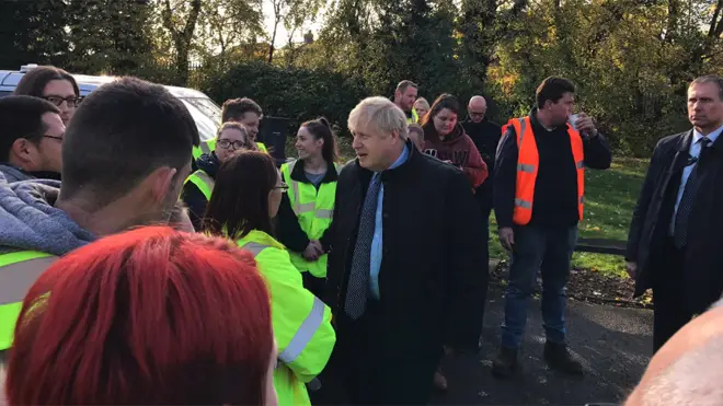 Boris Johnson visiting a centre for sorting food donations for the cut off village of Fishlake