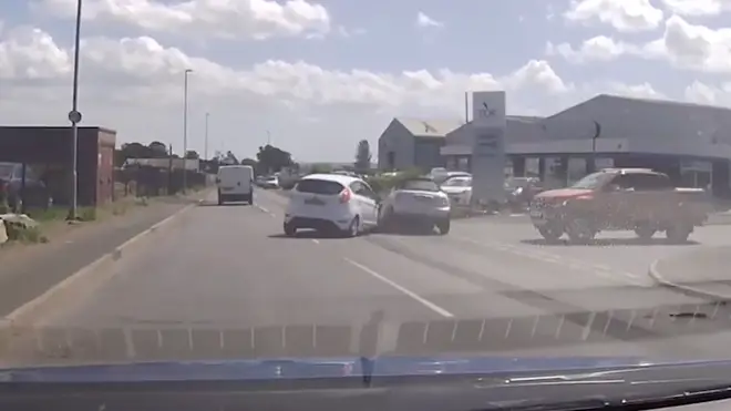 The moment a Mini gets flung into the air after colliding with another car.