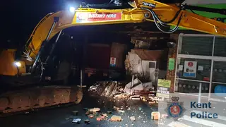 The digger smashed into the Co-op store in Cranbrook