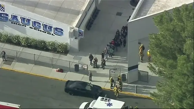 Students are led out of Saugus High School in California following a shooting