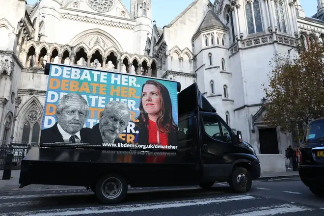 An advertising van showing Boris Johnson, Jeremy Corbyn and Jo Swinson