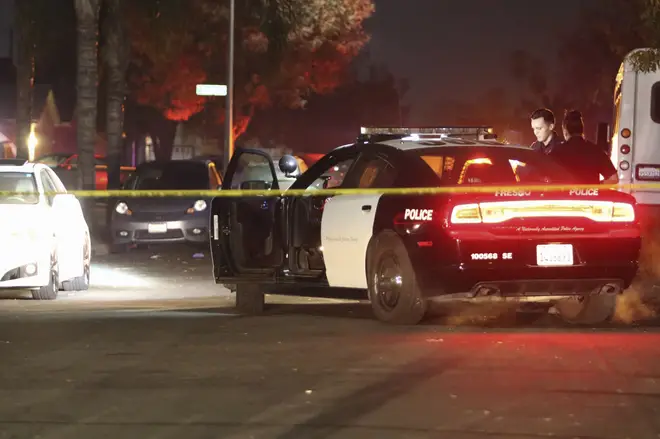 Police work at the scene of a shooting in southeast Fresno, California