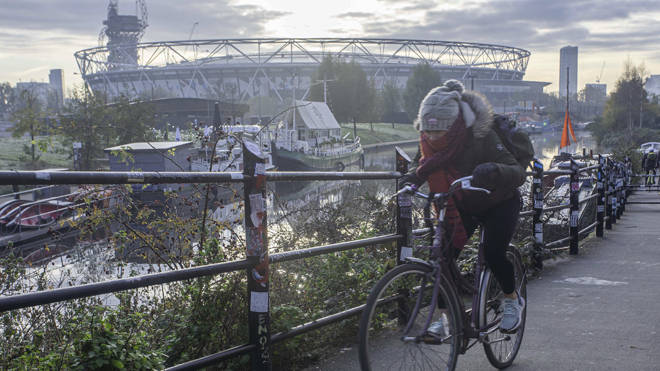 A cyclist in east London during the freezing weather this morning
