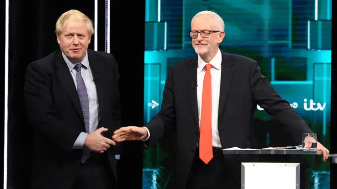 Mr Johnson and Mr Corbyn shake hands during the debate