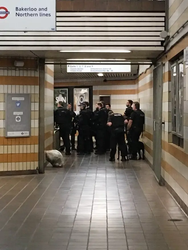 Police gathered in the entrance to the Underground at Charing Cross Station