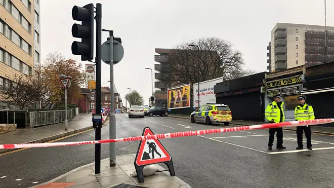 Police at the scene of a fatal stabbing in Ealing