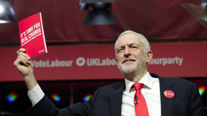 Jeremy Corbyn shows off the Labour manifesto