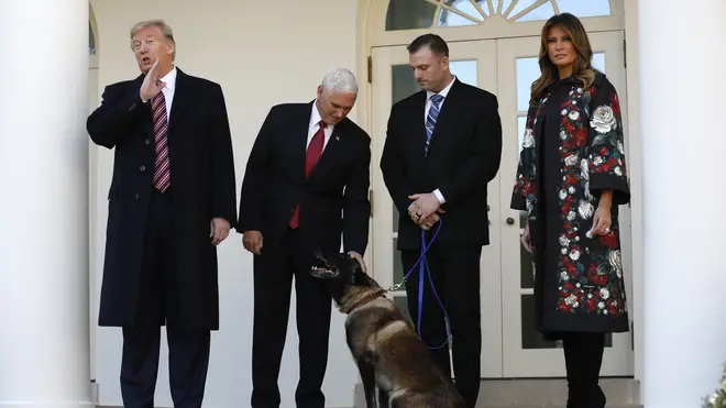 U.S. President Donald Trump with Vice President Mike Pence and First Lady Melania Trump introduce to the media military dog Conan
