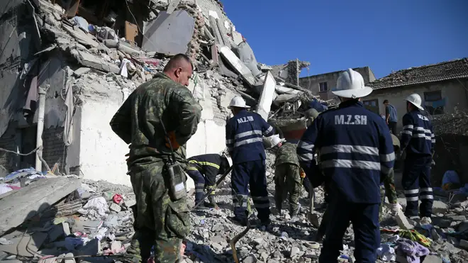 Rescuers scour the rubble after the earthquake in Albania