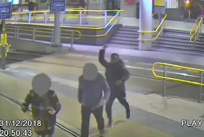 Handout grab taken from CCTV issued by Greater Manchester Police of Mahdi Mohamud attacking James Knox at Manchester Victoria railway station last New Year's Eve.