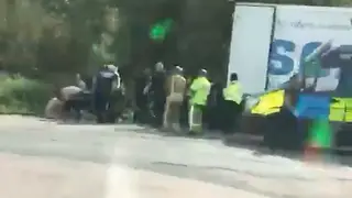 Fourteen men have been found inside the back of a lorry.